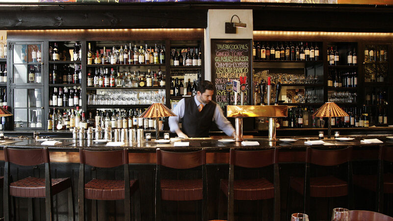 Bartender at the bar trained by Perennial Restaurant Group Consulting.
